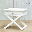 Diagonal view of the nightstand highlighting its solid construction and crisp white finish