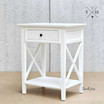 Zoomed-in view focusing on the bedside table's crisp white satin finish