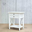 Angled view focusing on the bedside table's crisp white satin finish