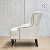 Avery Armchair Side Angle: Rolled arm and side silhouette in cream natural linen upholstery