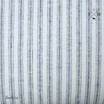 Detailed shot of the blue and white ticking stripe linen fabric