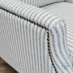 Close view of the meticulous studded detailing and Hamptons style blue and white ticking stripe
