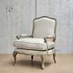 Angled view, displaying the armchair's elegant contours and French Provincial or Hamptons style