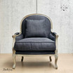 Front perspective of Montpellier Armchair in charcoal black linen with weathered oak