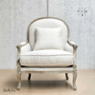 Front view of Montpellier Armchair in natural linen with weathered oak with backrest throw cushion