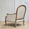 Rear angle highlighting the weathered oak frame with natural linen