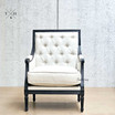 Front perspective of the Pembroke Armchair in natural linen with black oak frame