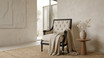 Designer occasional armchair with black timber frame and deep button tufted backrest