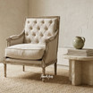 Premium lounge chair in tufted cream upholstery styled in a contemporary classic living room