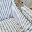 Detailed view of the Hamptons style blue and white ticking stripe linen upholstery