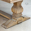 Close-up view of the table’s pedestal base, highlighting its unique and sturdy design