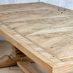 Angle shot of the table top corner, emphasizing the parquetry and edge finish