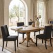 Lumley Dining Chair styled around a luxury pedestal dining table in a warm minimalist dining room by Thomas and Hurley
