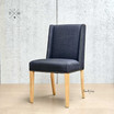 Angle view showcasing the chair’s winged back design, ideal for a comfortable dining experience.