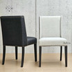 Pair of Lumley Dining Chairs positioned at contrasting angles, offering a dynamic view that highlights the elegant winged back design and brass stud detailing of each chair. This perspective showcases the chairs' compatibility in a dining room setting, emphasising their classic lines and contemporary appeal, perfect for modern and Hamptons-style interiors.