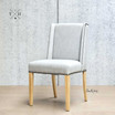 Angle view showcasing the chair’s winged back design, ideal for a comfortable dining experience.