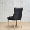 Back view of the dining chair, showcasing the fine craftsmanship and elegant lines of the design