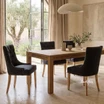 Thomas and Hurley Braddock Dining Chair in Black with Natural Leg styled in a light-filled dining space with elegant contemporary classic décor.