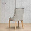 Back view of the dining chair, showcasing the fine craftsmanship and elegant lines of the design.