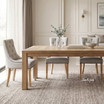 Premium upholstered dining chair with button-tufted back and natural timber legs by Thomas and Hurley, designed for elegant Australian interiors.
