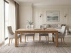 Luxury dining seating by Thomas and Hurley with wingback styling, natural upholstery, and handcrafted timber legs for sophisticated dining spaces.