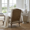 Cara Occasional Armchair in Weathered Oak with Rattan Back by Thomas & Hurley styled in a luxury Hamptons living room