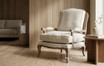 Weathered oak lounge chair with handcrafted rattan back in a luxury Australian interior
