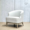 Angled view of this statement occasional tub chair showcasing its sophisticated silhouette