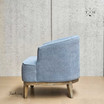 Left side profile of the Hamptons tub chair, highlighting its rounded silhouette