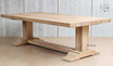 An image capturing the natural wood patterns and grain of the Charlested Oak Dining Table, showcasing its organic beauty