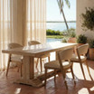 Styled angled image of the Charlested Oak Dining Table in a contemporary ocean front home