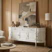 The Louis Buffet 200cm in White by Thomas and Hurley, front angle view and closed position, showcasing its curved design, fluted drawer detailing, and functional storage.