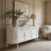 Angled shot of the Louis Curved Buffet in white in 200cm in a relaxed home setting