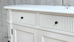 Detailed close-up of the intricate grooved detailing on the drawers of the Louis Petite Buffet.