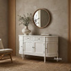 Angled view of the Louis Curved sideboard in white with ribbing detail in a modern home styled with a mirror
