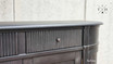 Detailed close-up of the intricate grooved detailing on the drawers of the Louis Petite Buffet.