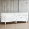 The Louis Curved Buffet’s grooved detailing captured in natural light, enhancing its texture