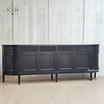 Angled View showcasing of the intricate grooved detailing on the drawers of the Louis Curved Buffet.