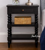 A front detailed view of the Montclair Side Table in Black showcasing its bobbin leg detailing and functional drawer and display shelving.