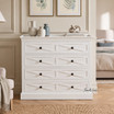 Elegant white storage chest featuring X-pattern drawer fronts.