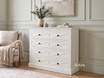 Fremont White Chest of Drawers featuring decorative geometric cross moulding.