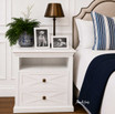 Contemporary classic white bedside table with geometric detailing and brass accent handles
