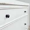 Close-up of drawer knob detailing the elegant hardware.