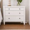 Front view of a white three drawer side table, perfectly complementing modern or Hamptons bedroom or living room spaces.