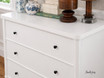 A close up view of a three drawer bedroom chest in white, which would perfectly complement either Hamptons or contemporary interiors.