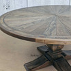 Detailed shot combining the pedestal base and parquetry top, showcasing the table's cohesive design elements.