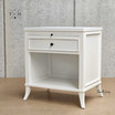 Angled view of Piastri Nightstand showcasing the spacious drawer and open shelf and elegant silhouette.