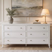 Close-up of the Piastri 6 Drawer Chest highlighting the hand-finished white paint-stroke patina, antique bronze handles and carved moulding for classic Hamptons style.