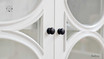 Detailed shot of the arch designs on the doors, reflecting the Neoclassical influence.