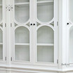 Close-up of the cabinet doors, revealing the detailed arch designs and high-quality craftsmanship.